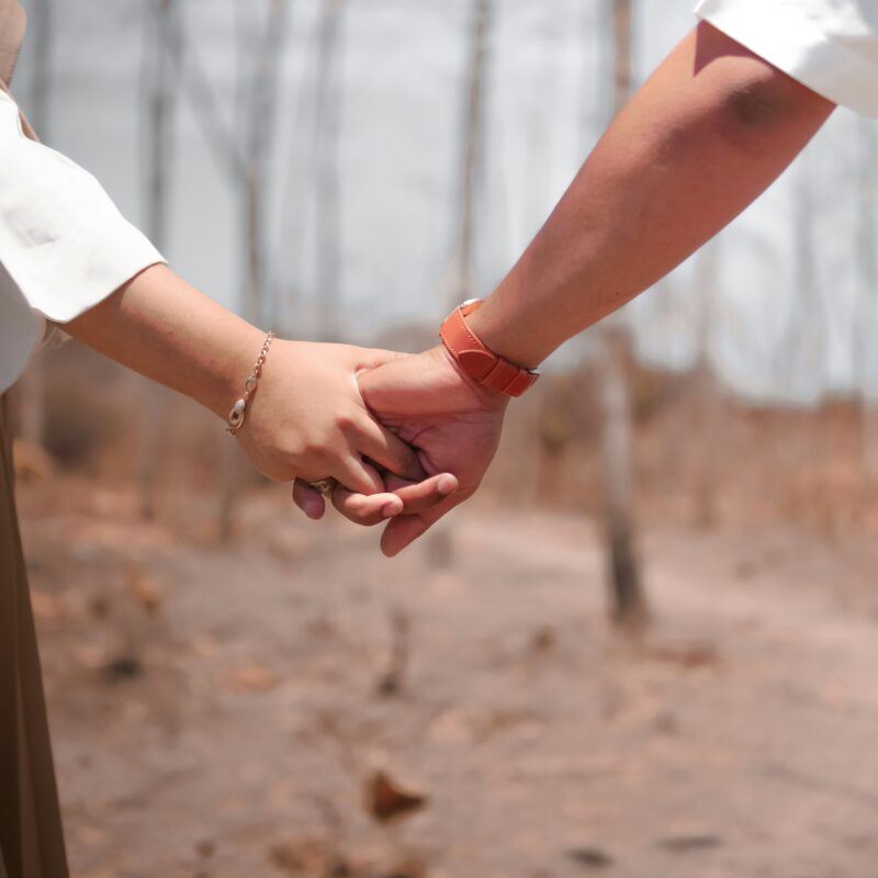 two people holding hands outdoors representing support during dual diagnosis mental health and addiction treatment in Texas at The Heights Treatment Houston Evidence Based Dual Diagnosis Treatment Center
